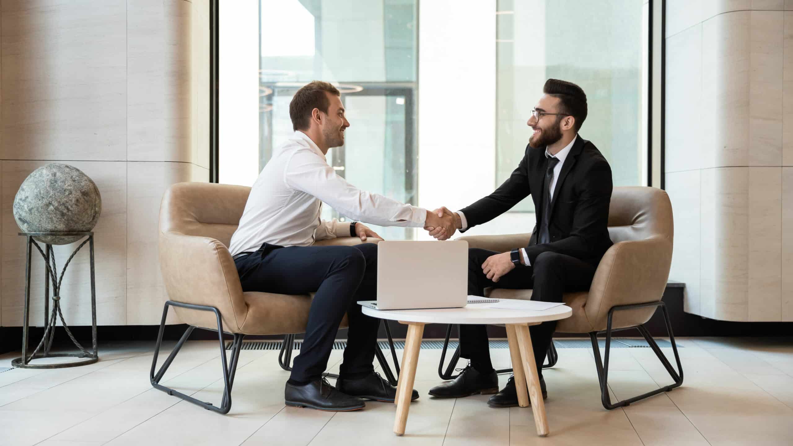 Men shaking hand at interview